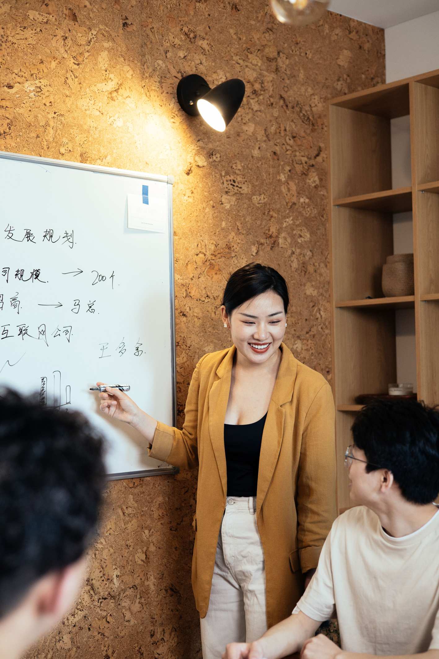Whiteboard with diagrams in a meeting room during a project discussion
